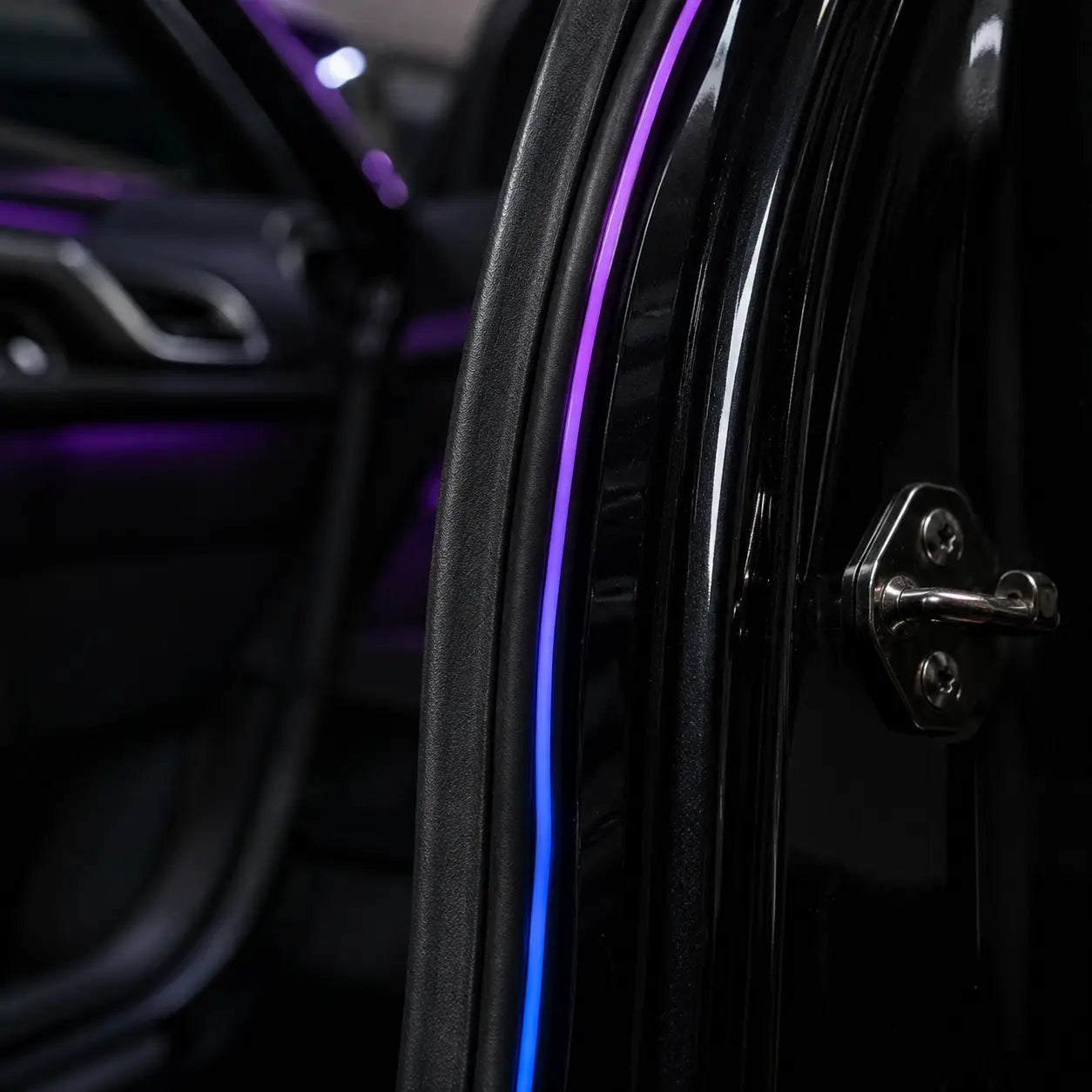 Close-up of a thin RoadGlow light strip beside the rubber weather seal of the fixed door opening